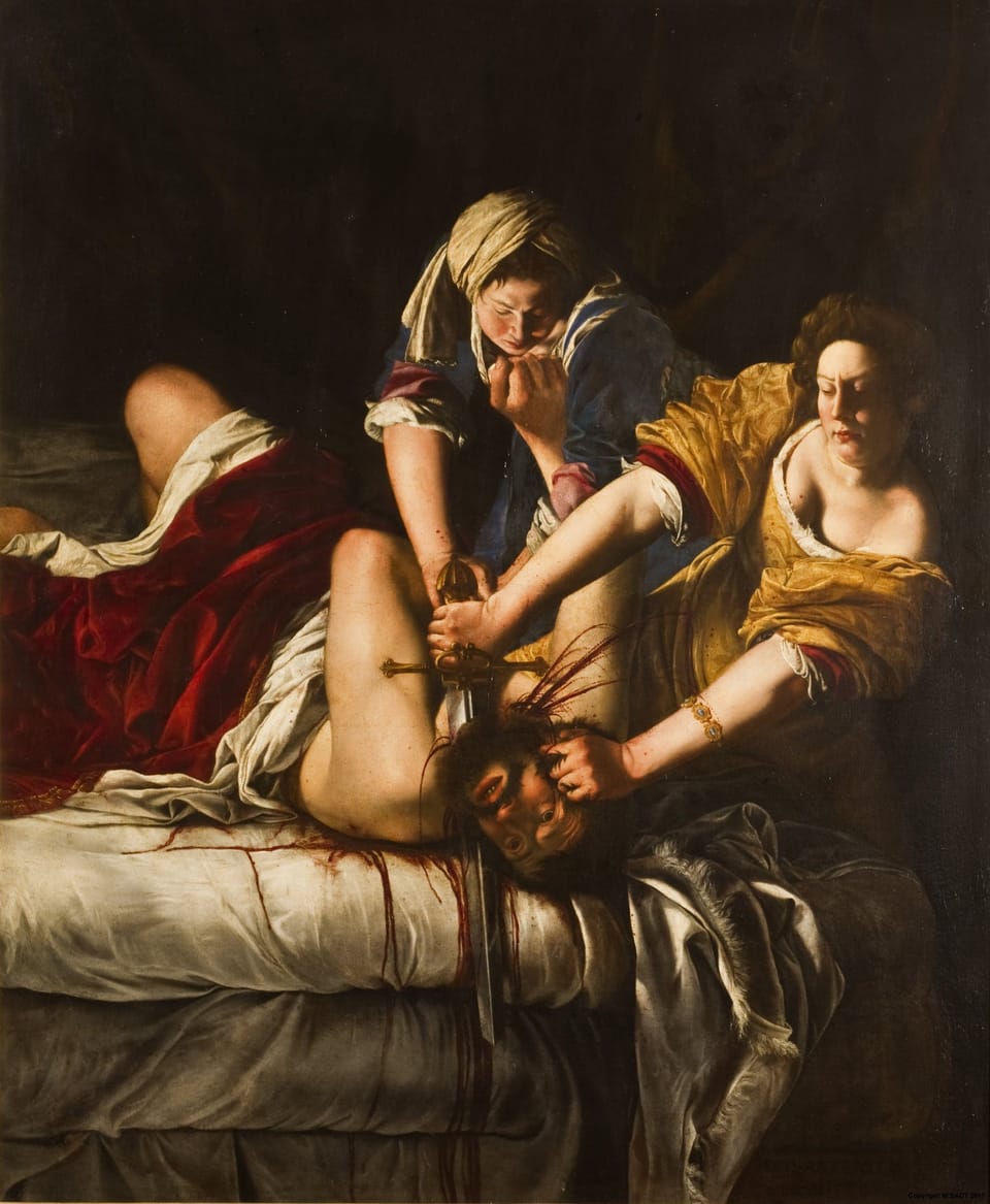 Two women hold a man down on a bed. One woman holds a short sword with which she is bloodily severing the man's head.